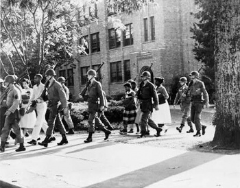 Members of the 101st US-Airborne Division escorting the Little Rock Nine to school. Little Rock, Arkansas Sep 1957